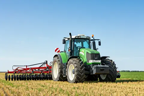 Agricultural tractor working in field - Crop support activities